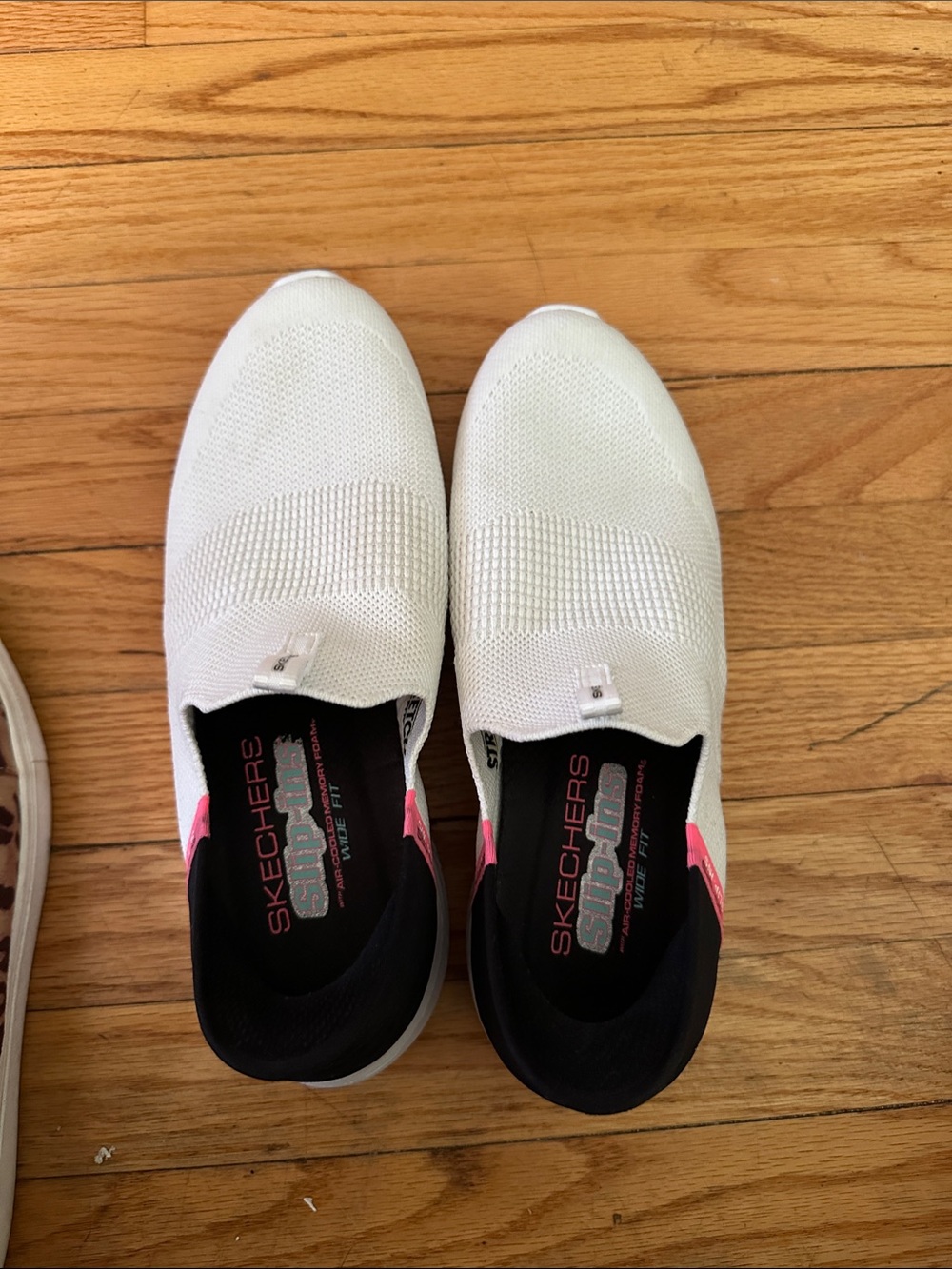 Skechers Slip-On Knit Sneakers in White with Pink Accents